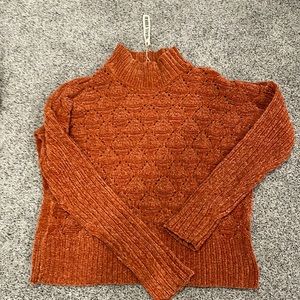 Really cute slightly cropped sweater, very soft never worn new with tags